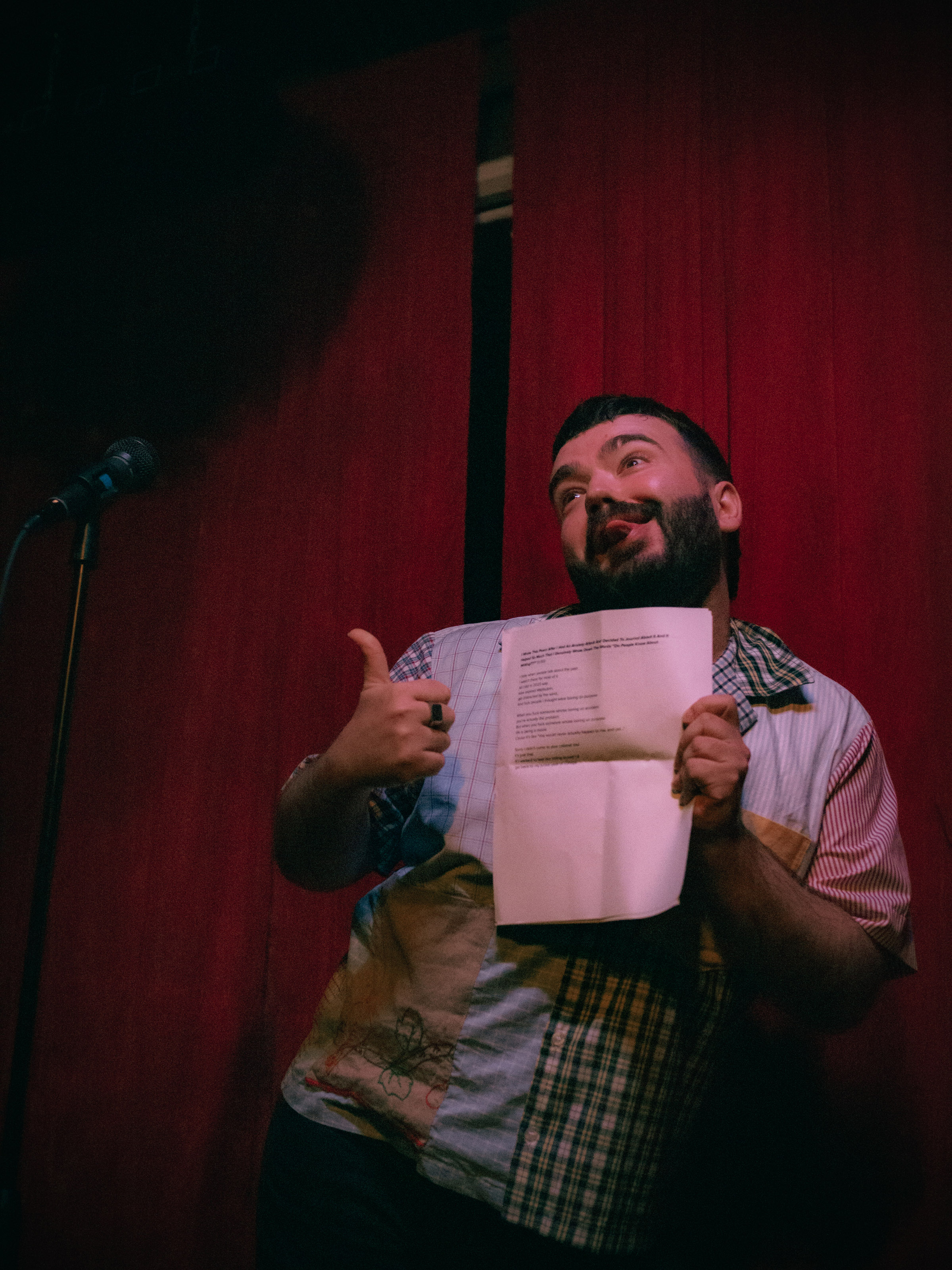 Comedian Patrick Howard shows off printed poetry.