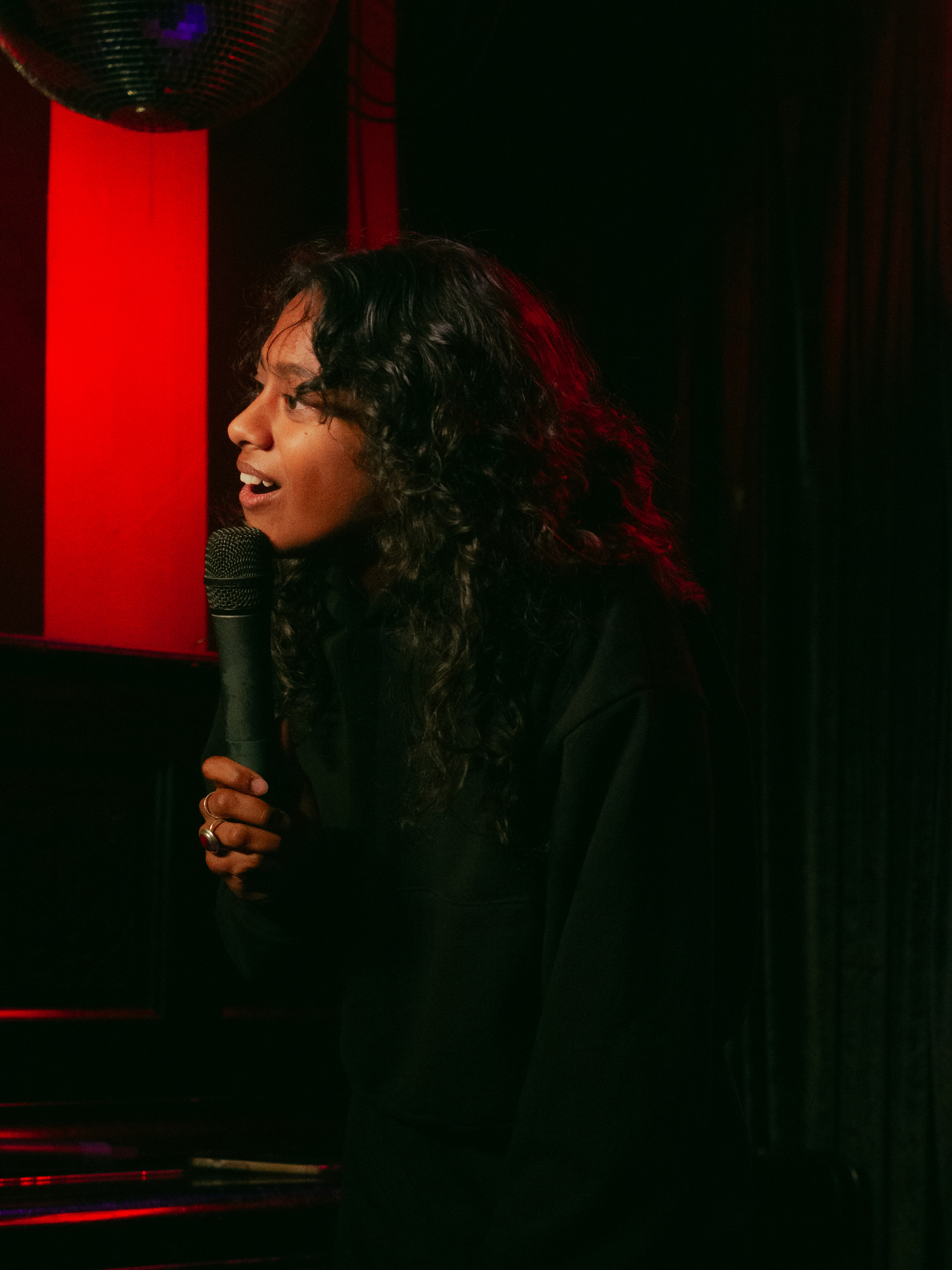 Sureni Weerasekera expresses shock in direction of audience.