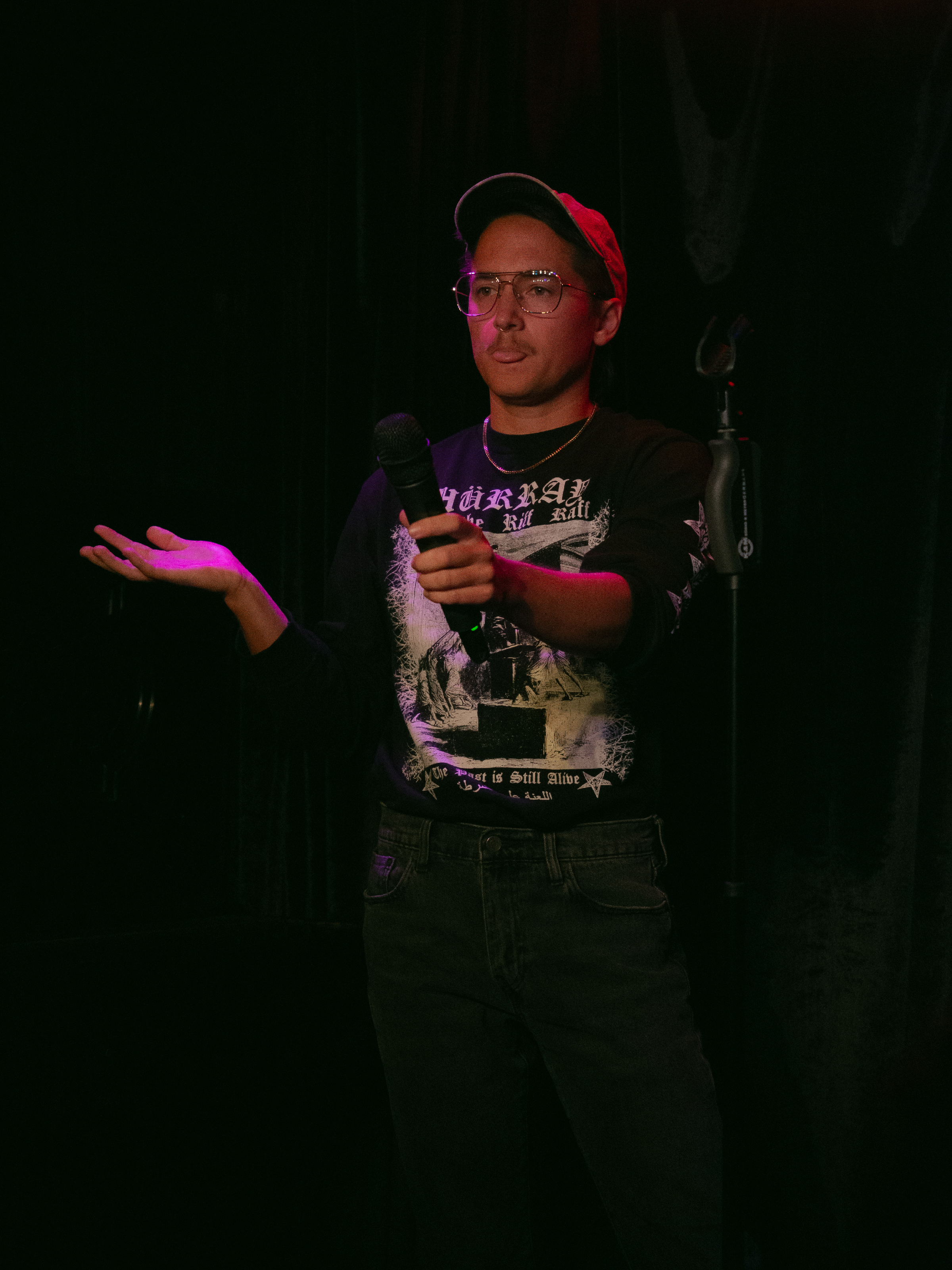 Tuck turns mic on audience.